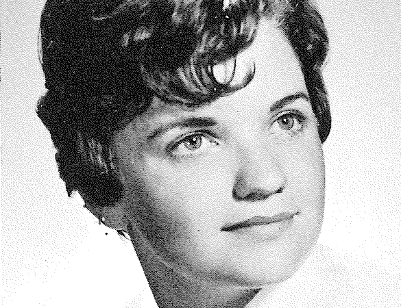 A black and white portrait of a young woman with short, curly hair, looking slightly to the side with a soft expression.