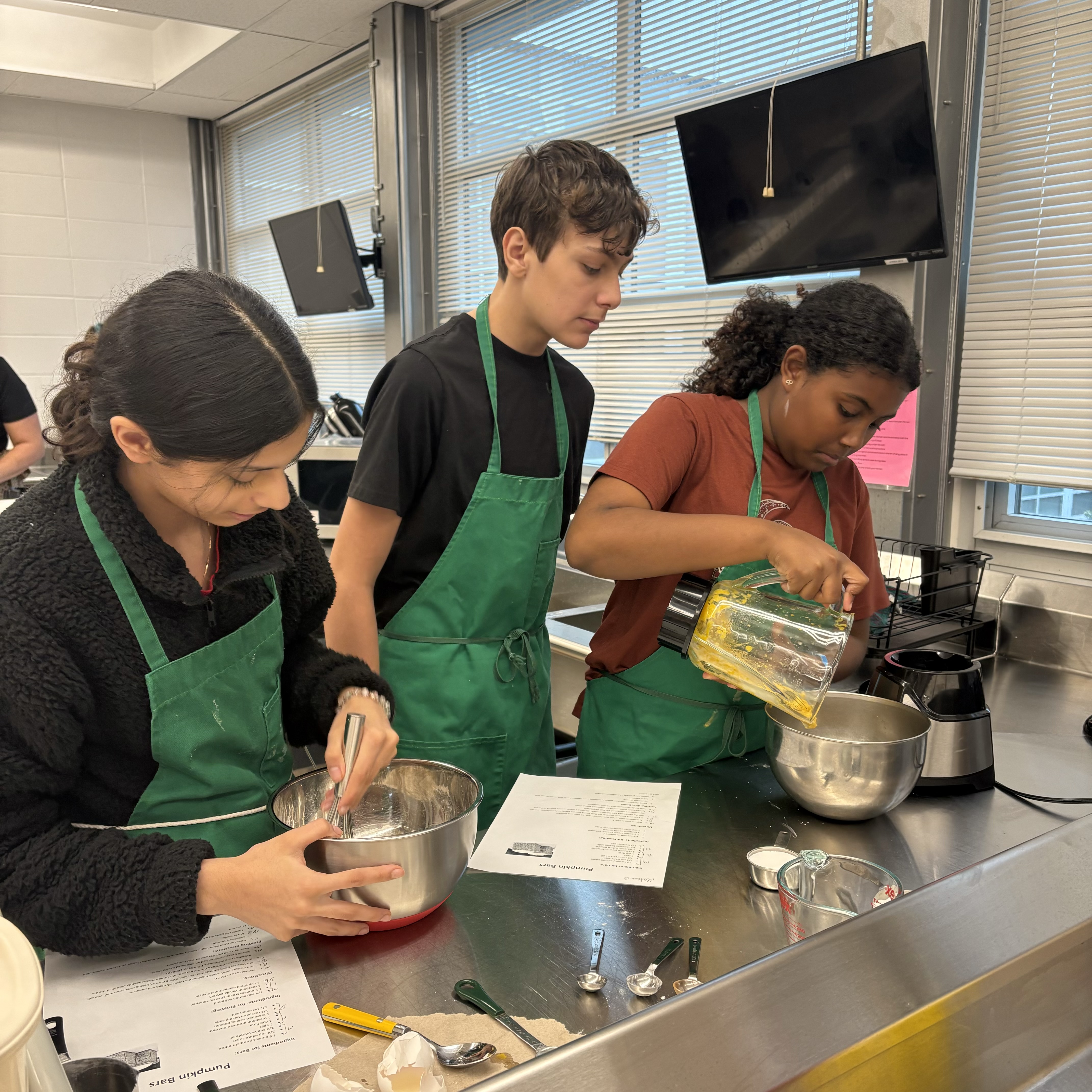 Students making pumpkin puree