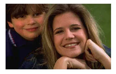 mom and kid smiling to camera