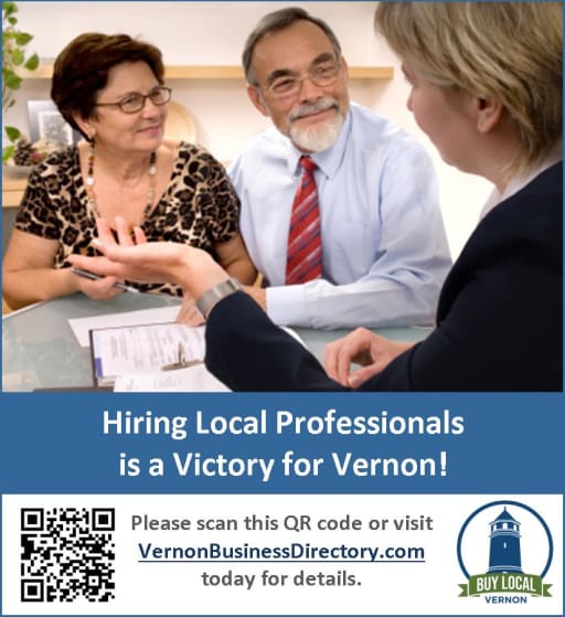 A group of three people engaged in a discussion at a table, with a QR code and promotional text encouraging hiring local professionals in Vernon.