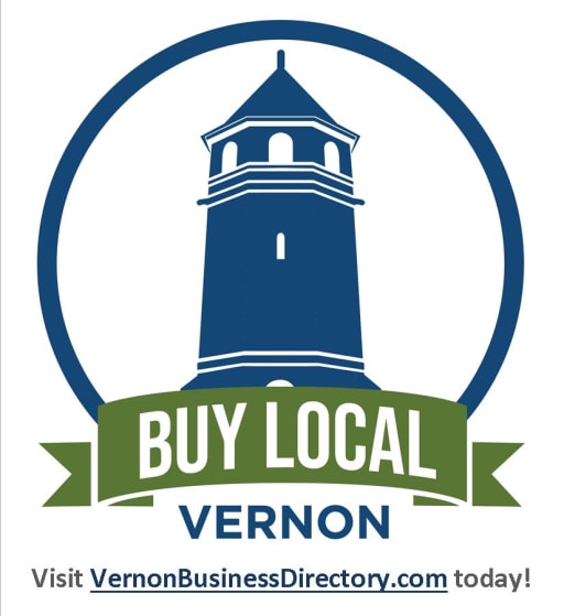 A logo featuring a blue silhouette of a lighthouse within a circular design, with the text 'BUY LOCAL VERNON' on a green ribbon below and a website link at the bottom.
