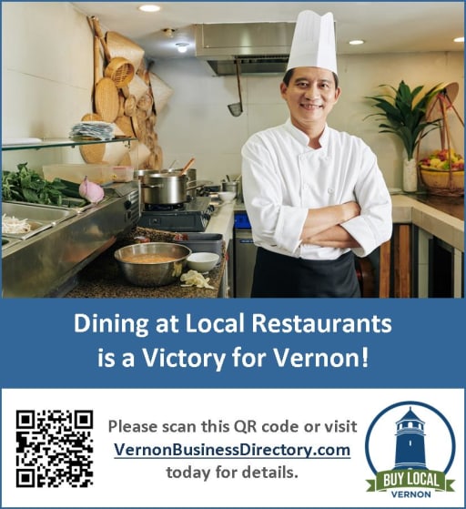 A smiling chef in a white uniform stands in a restaurant kitchen, promoting local dining with the message 'Dining at Local Restaurants is a Victory for Vernon!' and a QR code for more information.