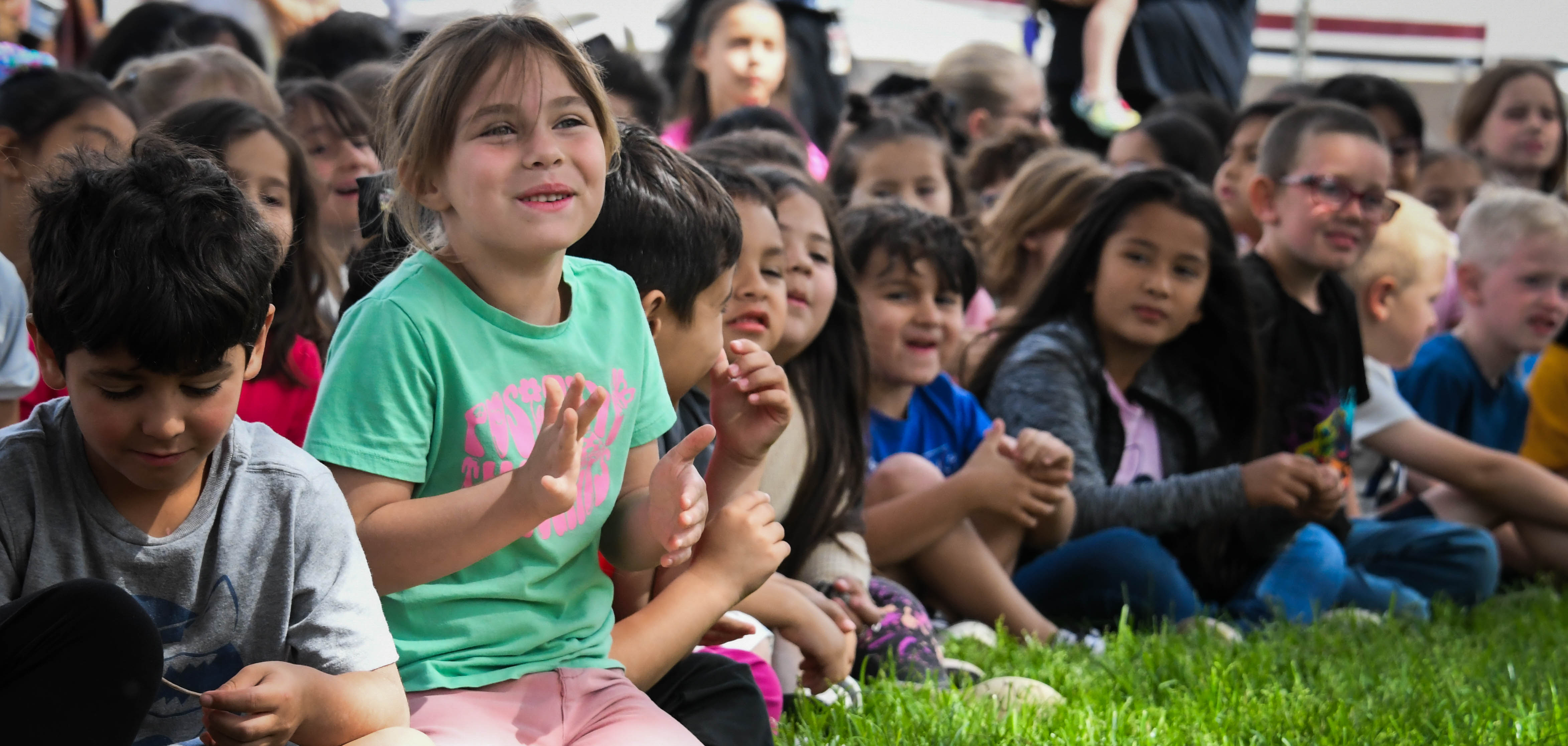 kids outside on the grass