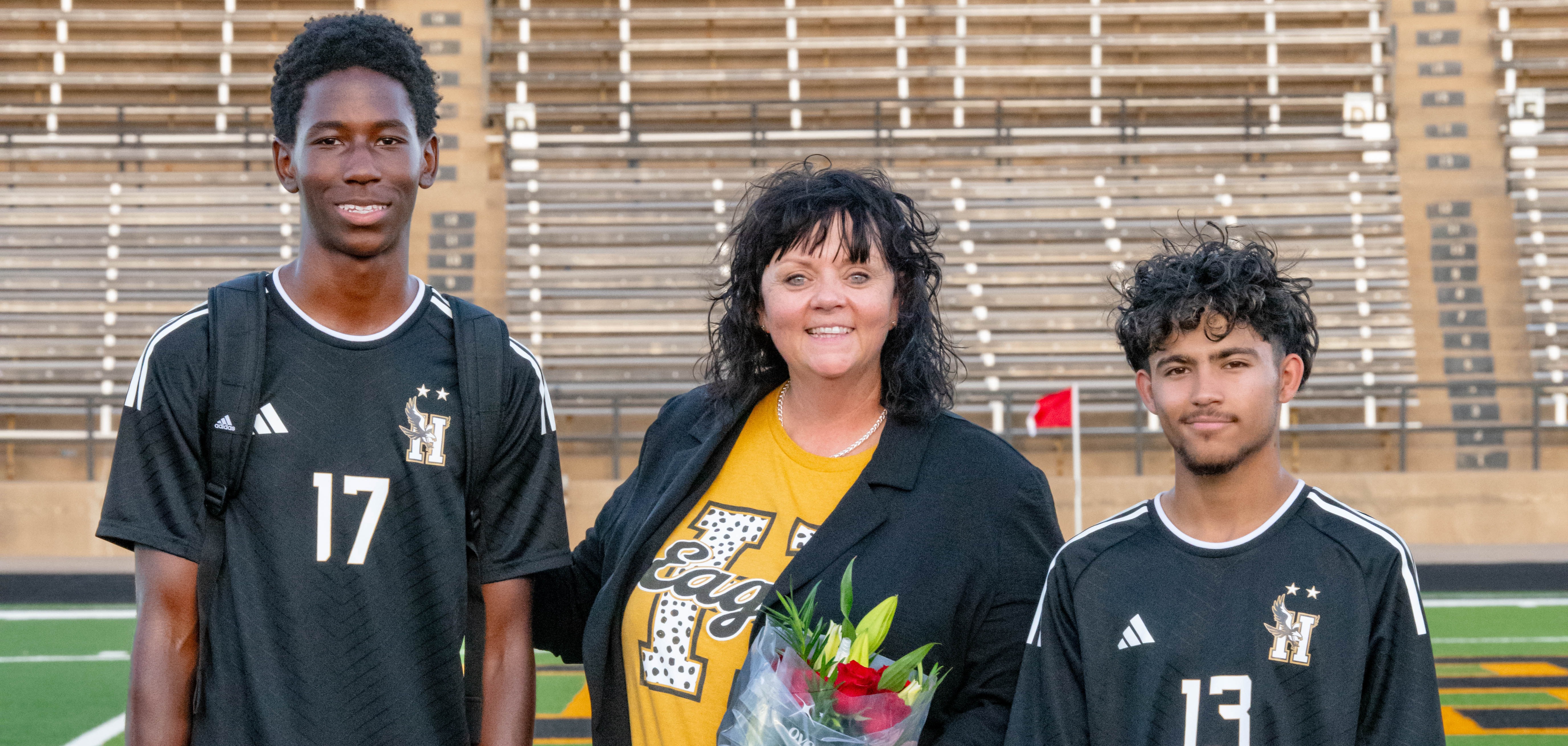 Hobbs Eagle Soccer Players shown with their teacher during the Teacher Appreciation Game.