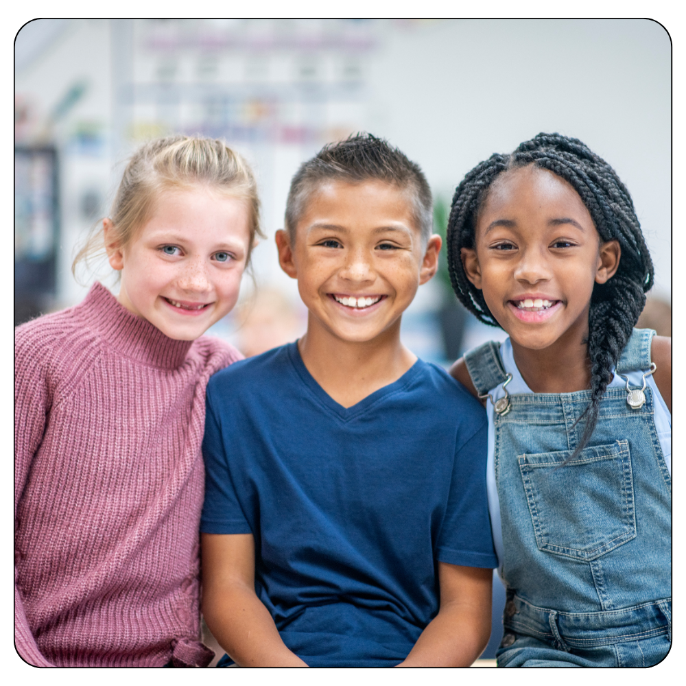 3 students smiling for the photo