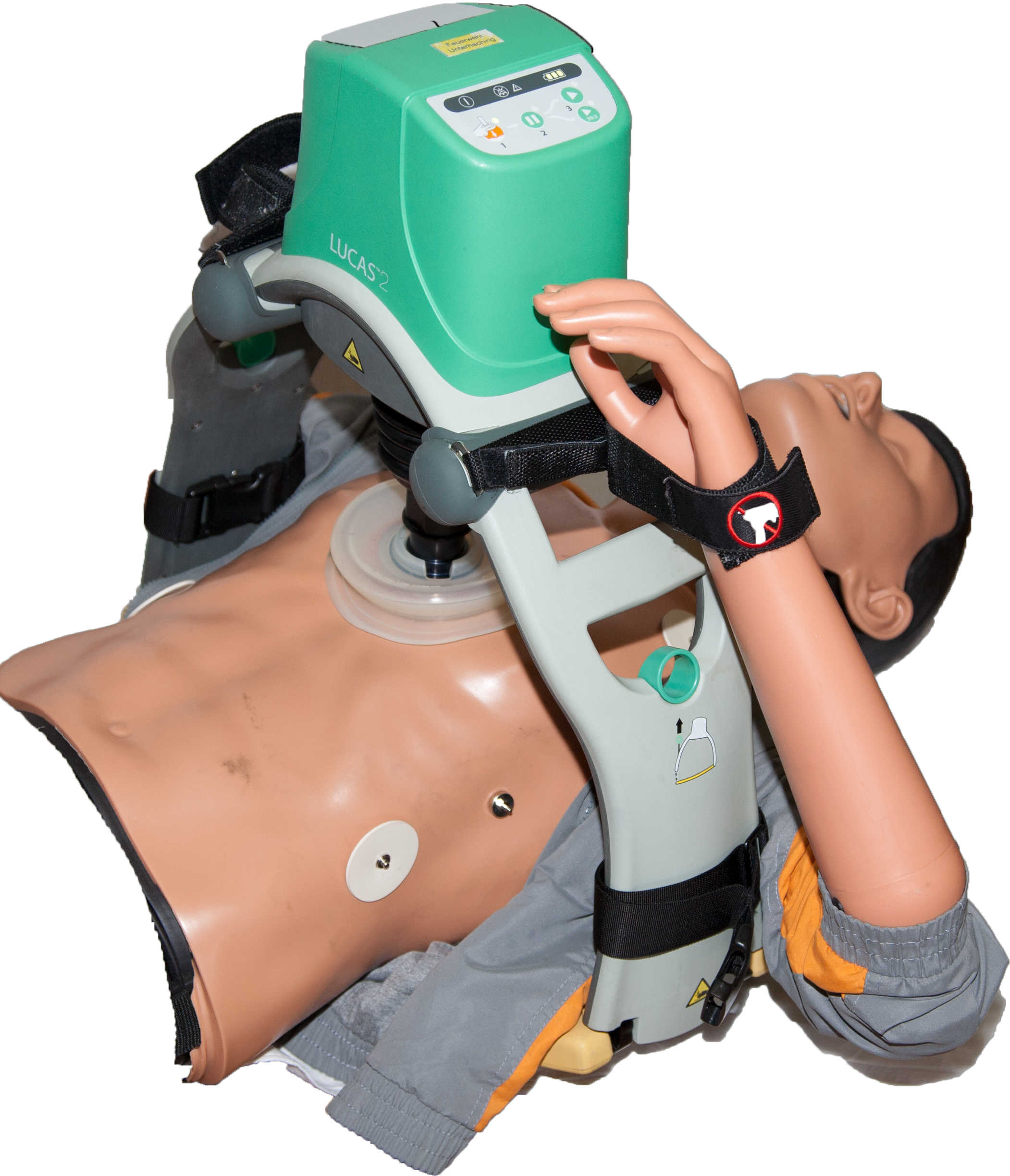 A CPR training mannequin with a mechanical chest compression device attached, demonstrating the process of performing CPR.