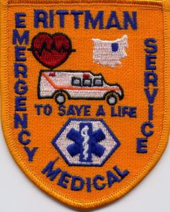 An embroidered patch featuring the words 'Rittman Emergency Medical Service' with symbols including a heart, an ambulance, a map outline, and a medical emblem.