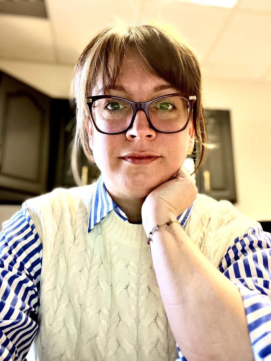 Woman with glasses with striped shirt