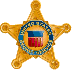 A gold star badge featuring a blue and red emblem in the center, with the words 'United States' around it.