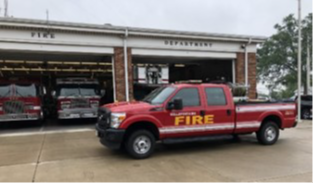 Bellefontaine Fire Department Grass 21 Parked in front of the Bellefontaine Fire Department