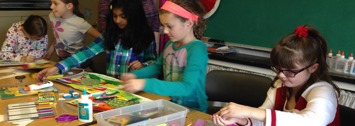 5 female students working on an art project