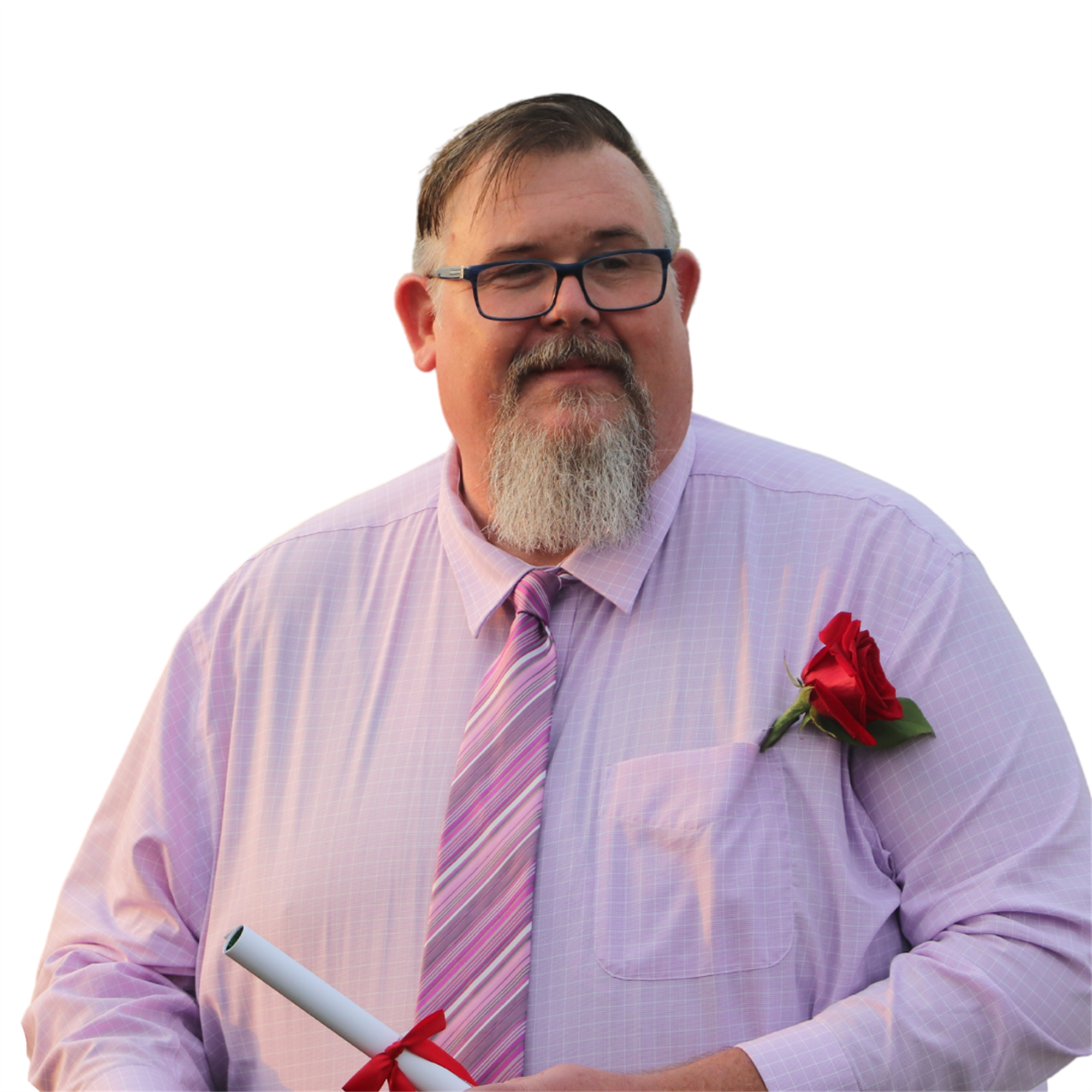 A man with a beard and glasses, wearing a light purple shirt and a pink tie, holds a rolled diploma and has a red rose pinned to his shirt.