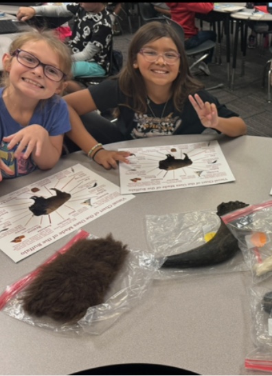 Two girls from Ms. Crim's Class using the Buffalo Boxes.