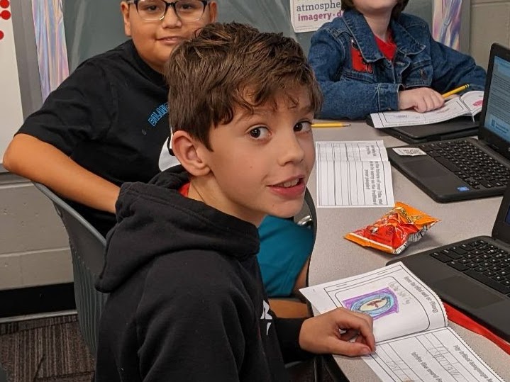 Students holding their school work