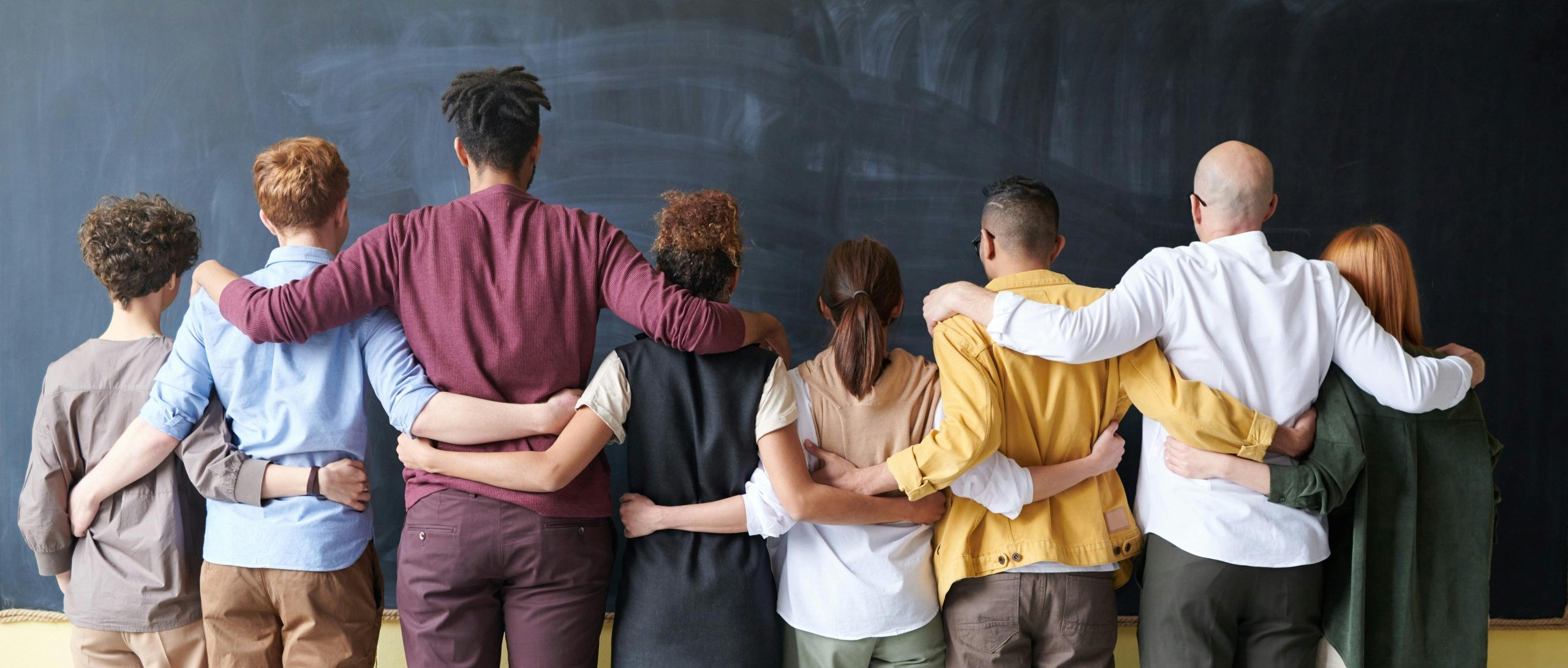 People standing arm and arm