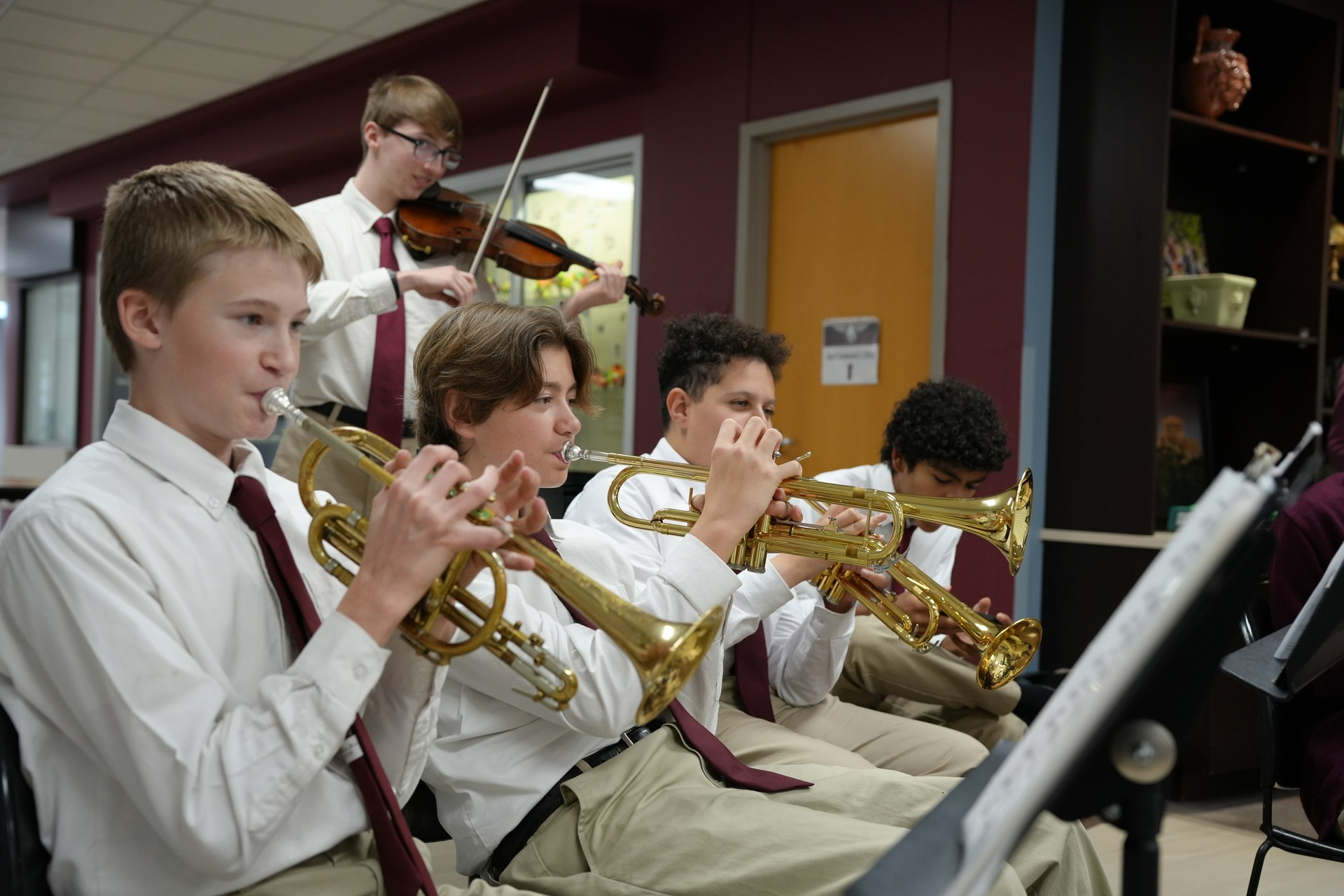 students playing instruments in uniform