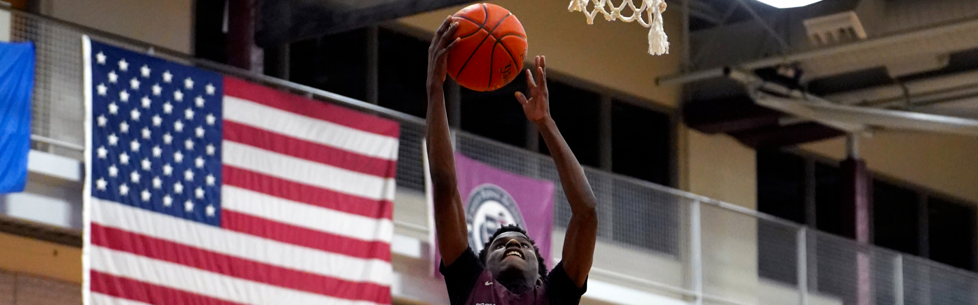 basketball player dunking ball