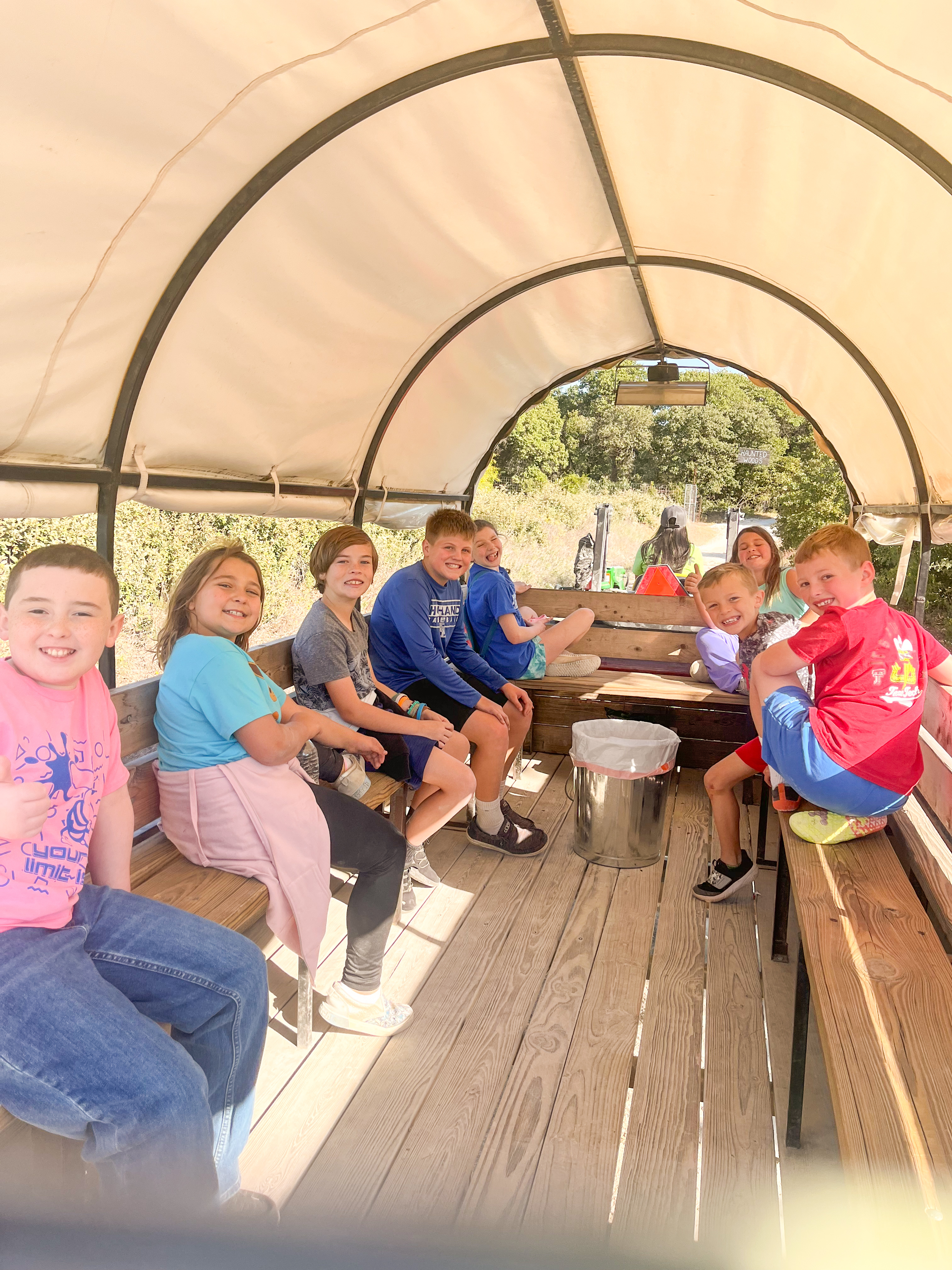 Students on a covered wagon