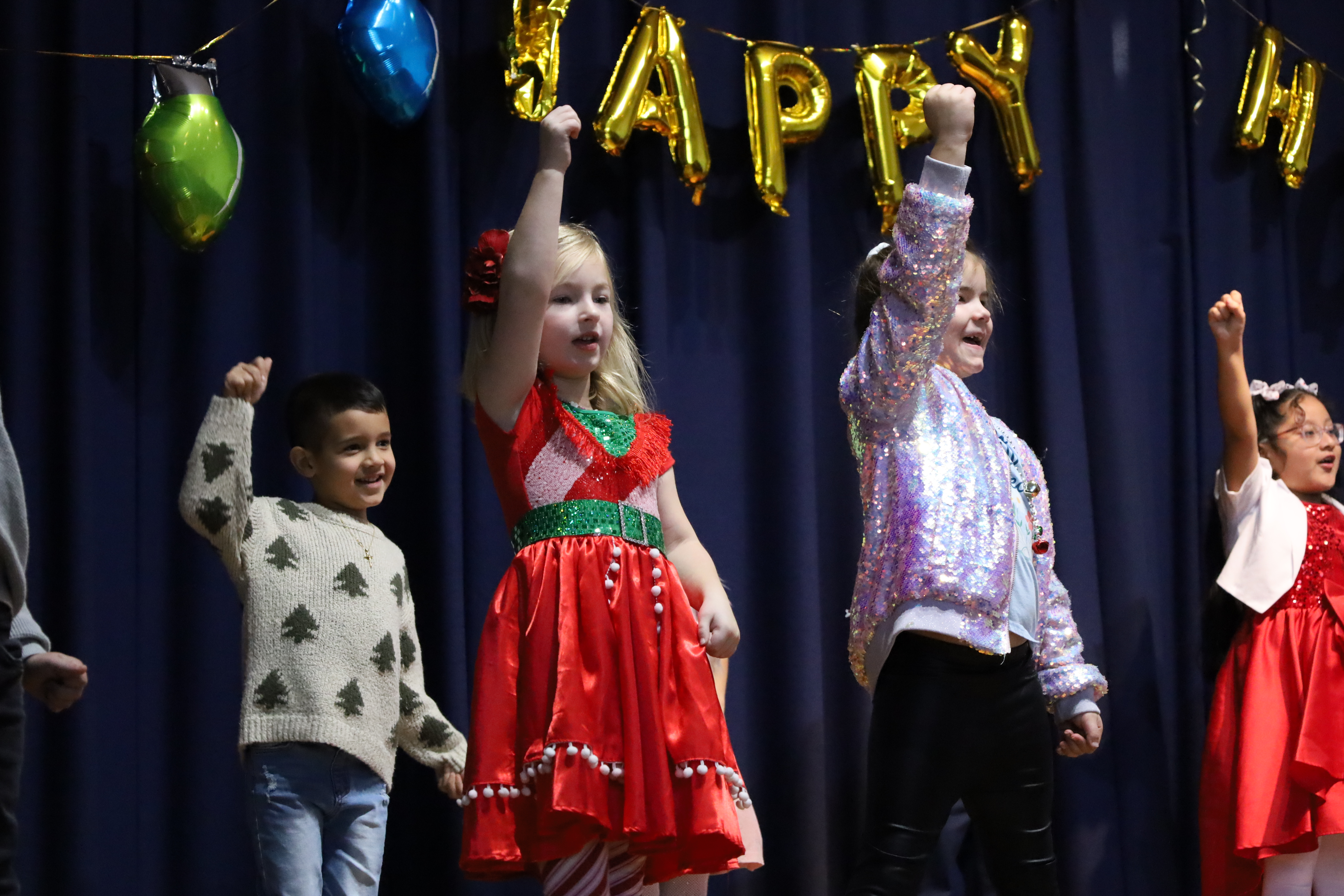 1)	First graders at Reinhard Early Childhood Center ushered in the holiday season with songs on Dec. 18. 