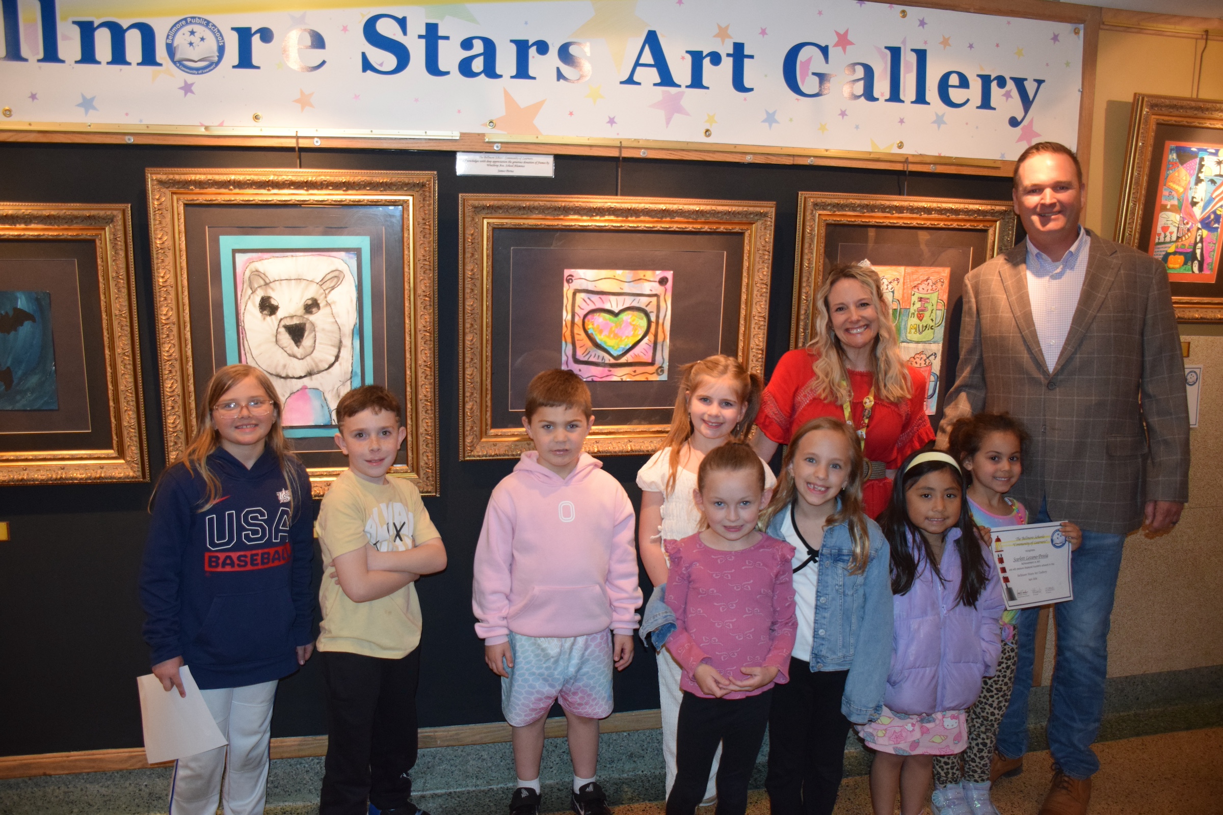 1) Bellmore School District staff and students took a tour during the debut of the student art gallery on April 28.