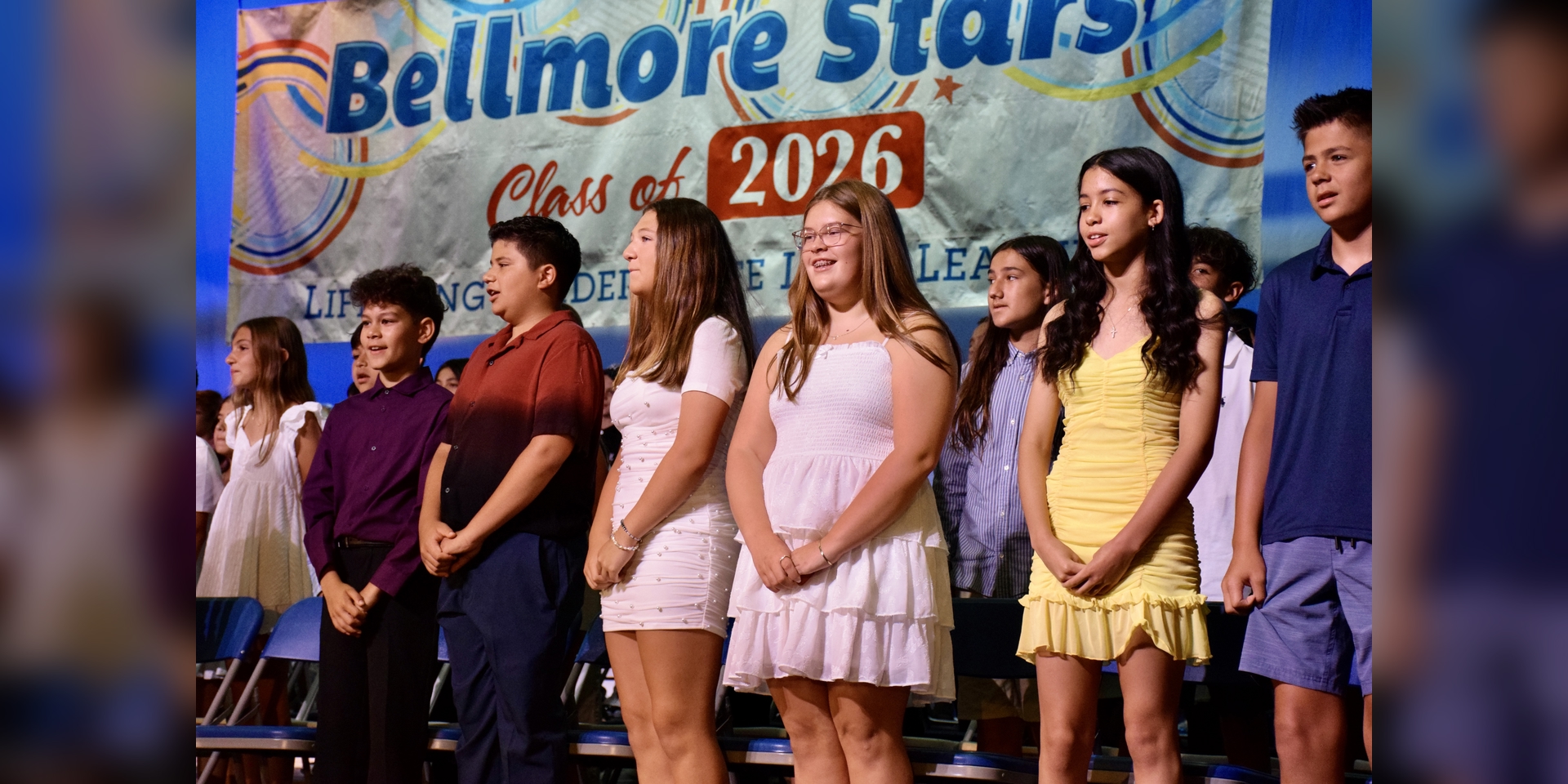 students on stage performing