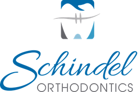 Tooth above Schindel logo