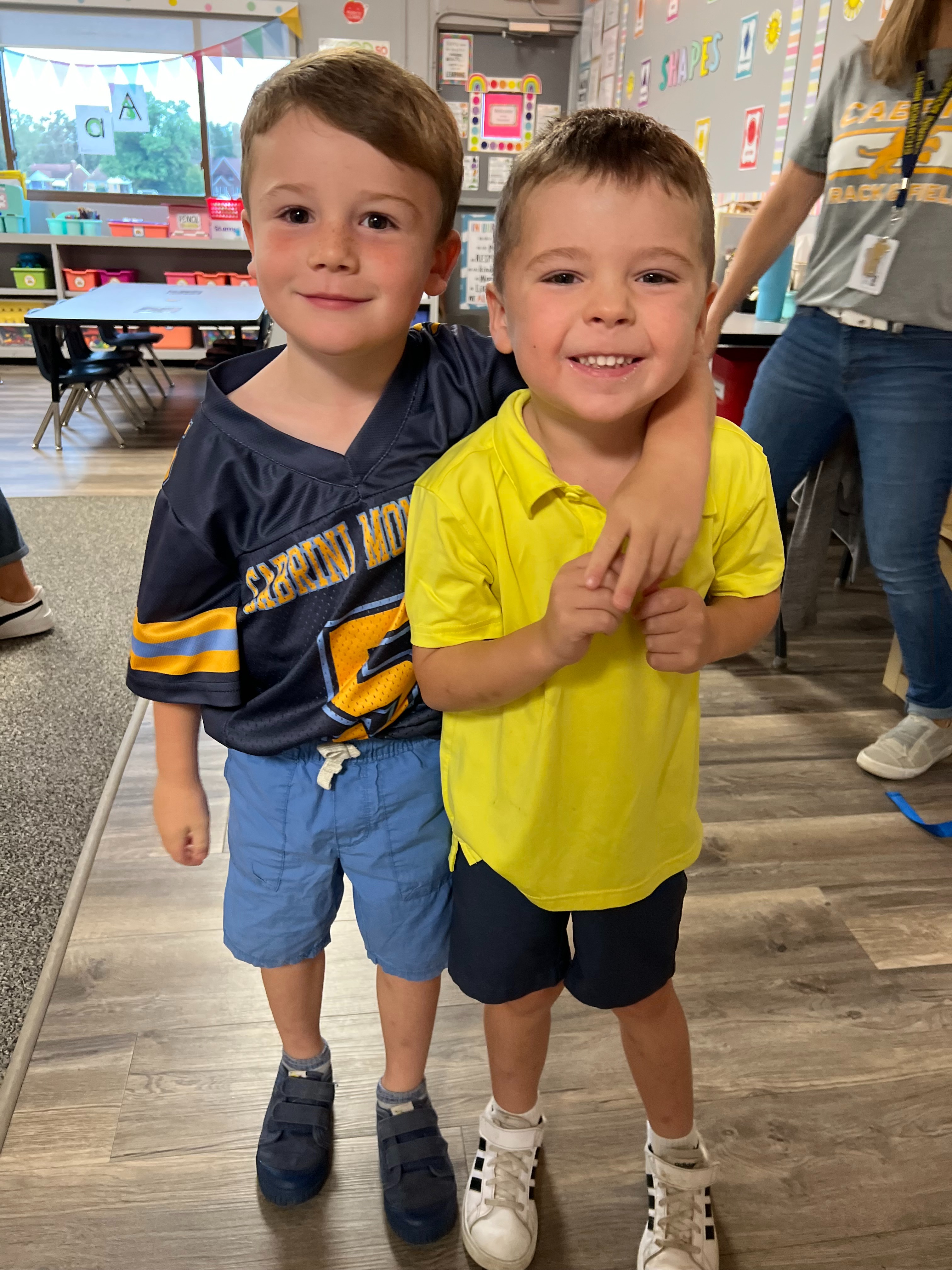 Pre-school boys smiling in classroom