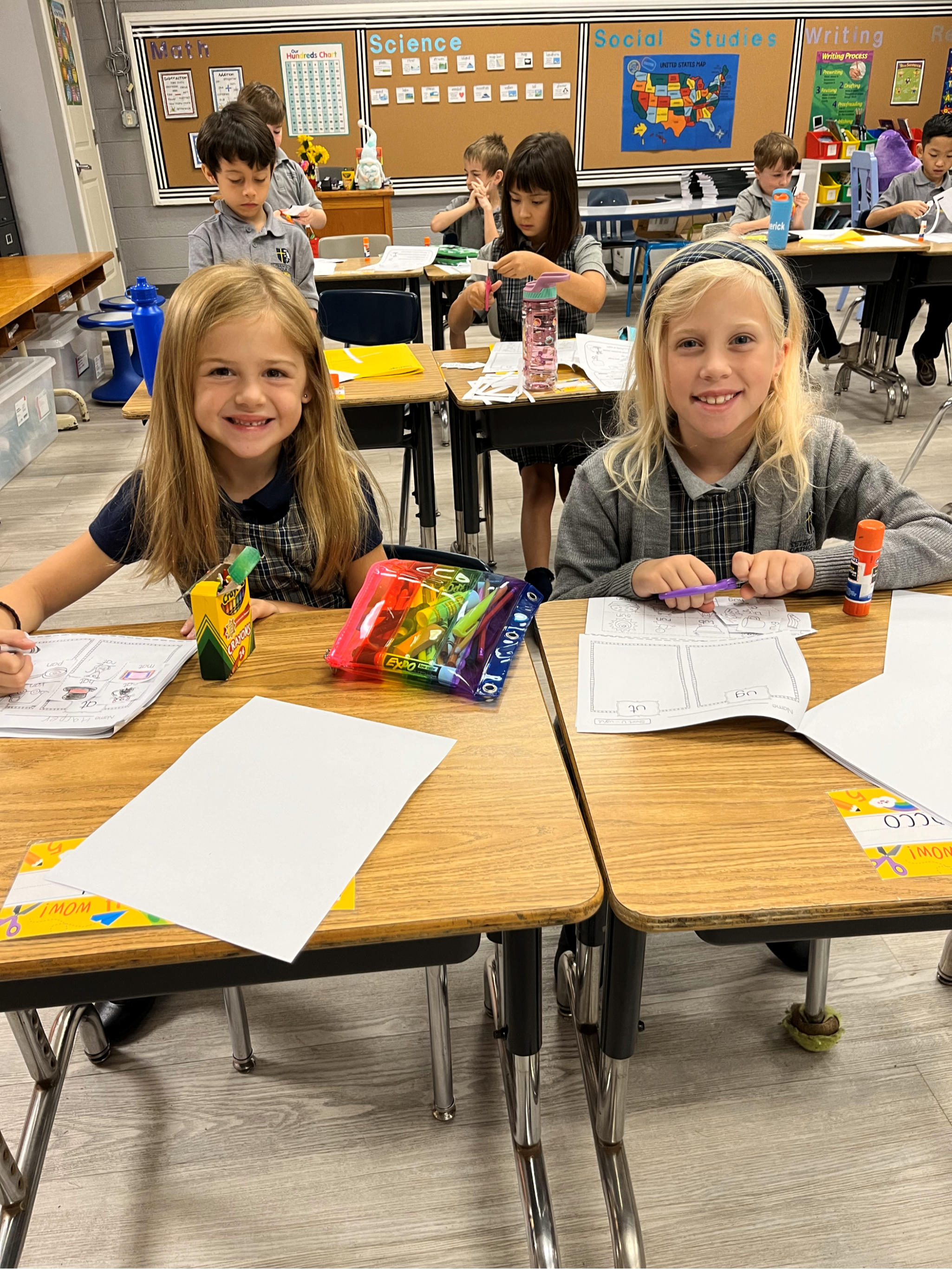 grade school girls working hard