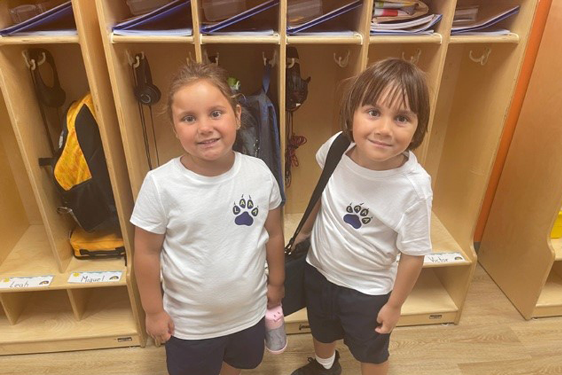 two students  smiling posing for photo