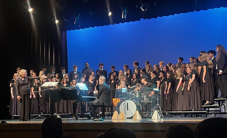 chorus students perform on stage