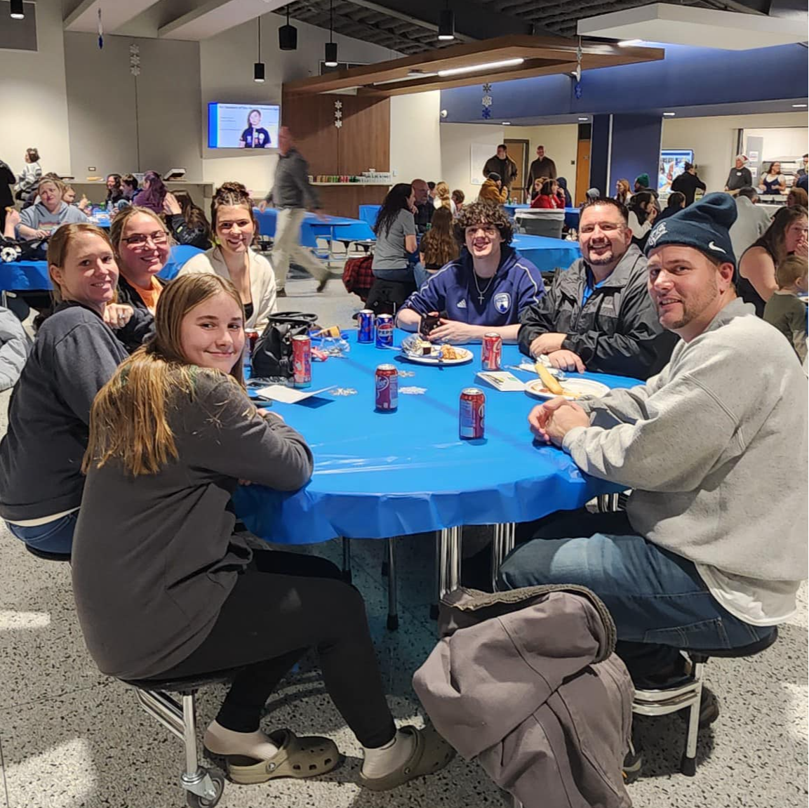 Table full of people eating at the EJCS community dinner