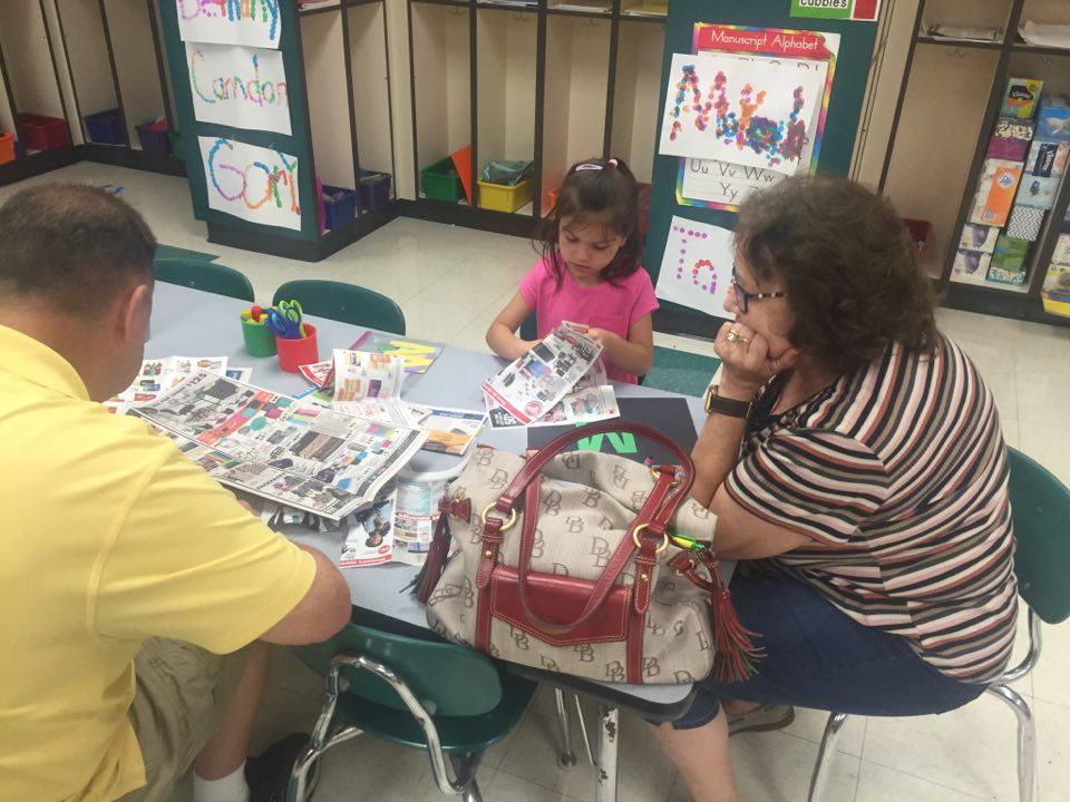 Photos of the parents working with their children on the classroom