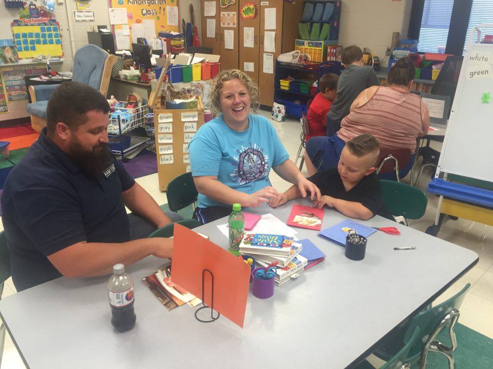 Photos of the parents working with their children on the classroom