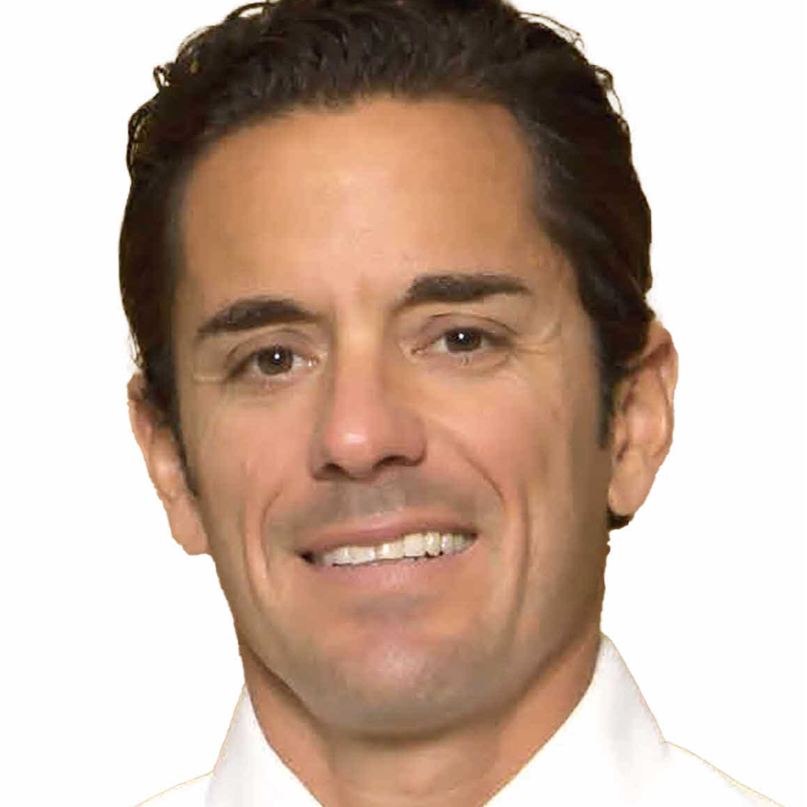 A man with short hair smiling