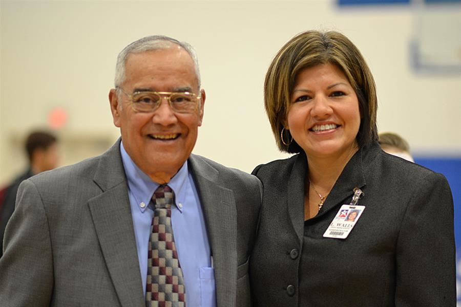 A man and woman smiling