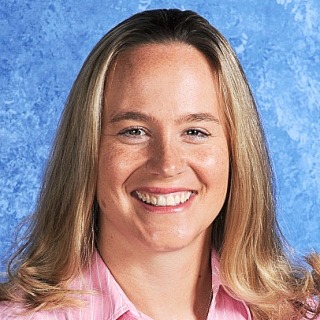 A smiling woman with blonde hair
