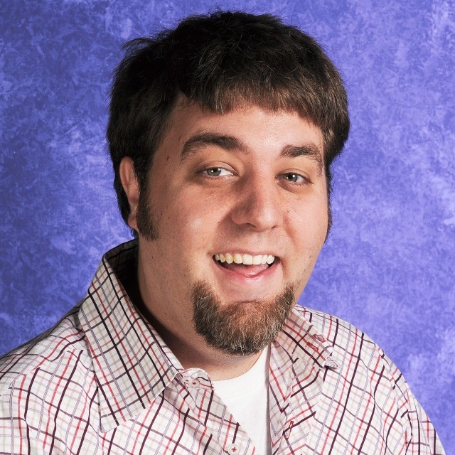 A smiling man with brown hair
