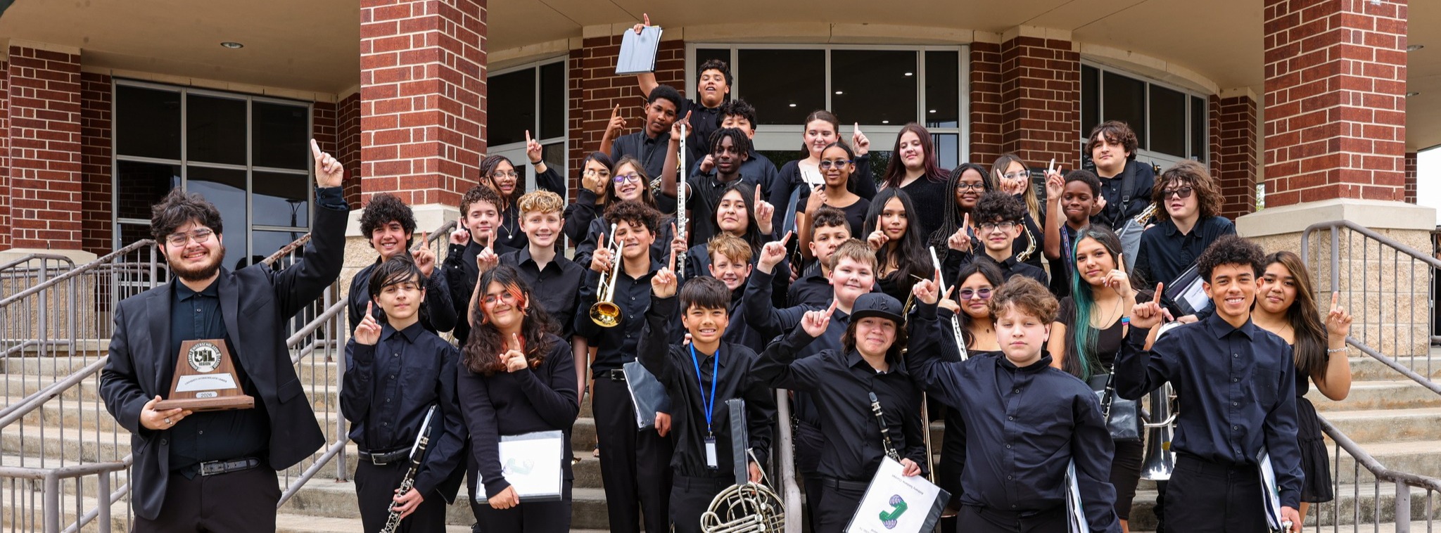 Chapa Middle School Symphonic Band pose for group photo outside of performing arts center