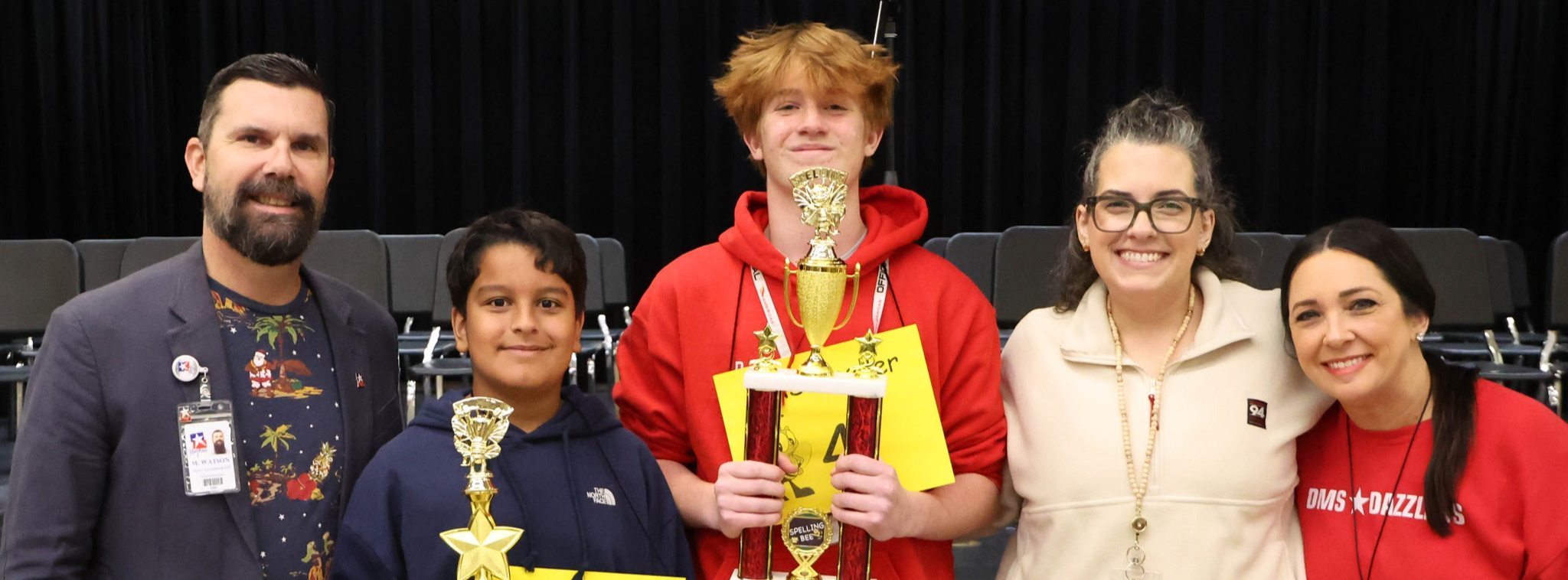 Two students with admin staff