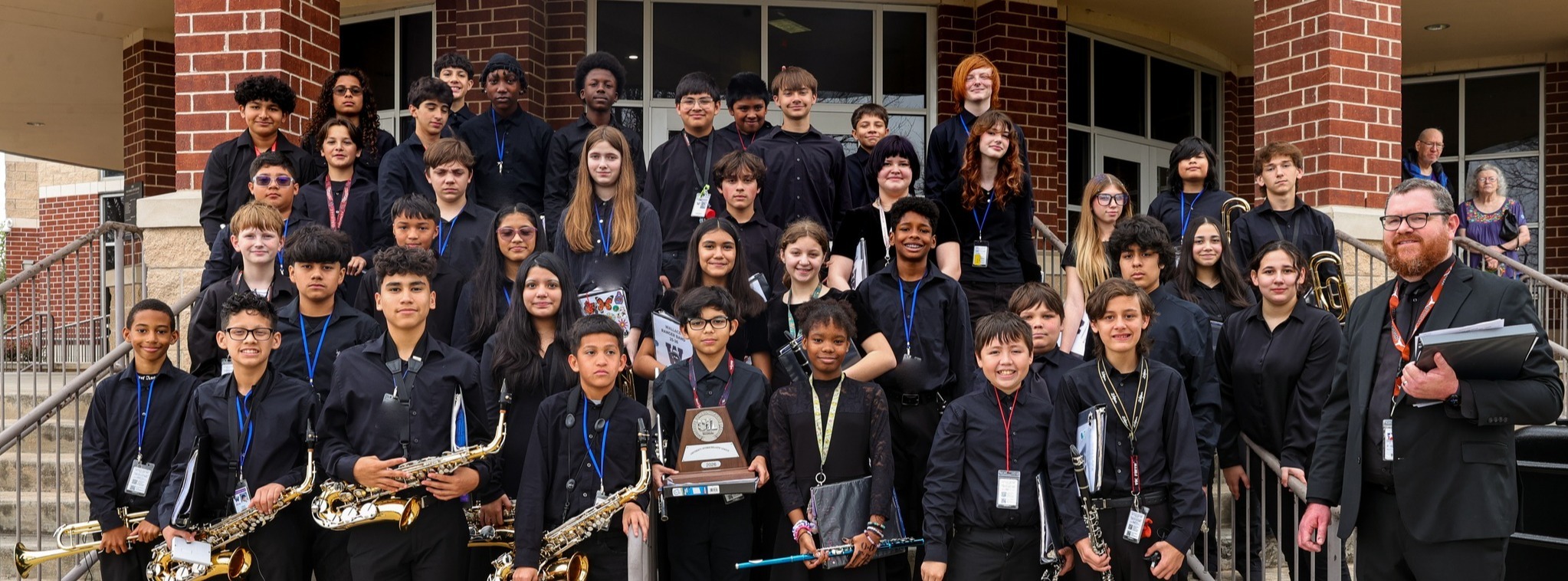 Ranger Symphonic Band posed for group photo outside of Performing Arts Center