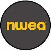 A circular logo featuring the letters 'nwea' in bold yellow font against a dark gray background.