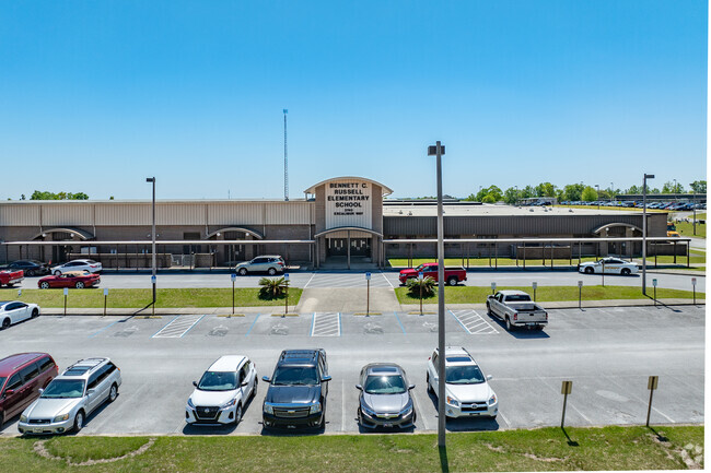 The facade of Bennett C Russell Elementary School with blue skies as a backdrop.