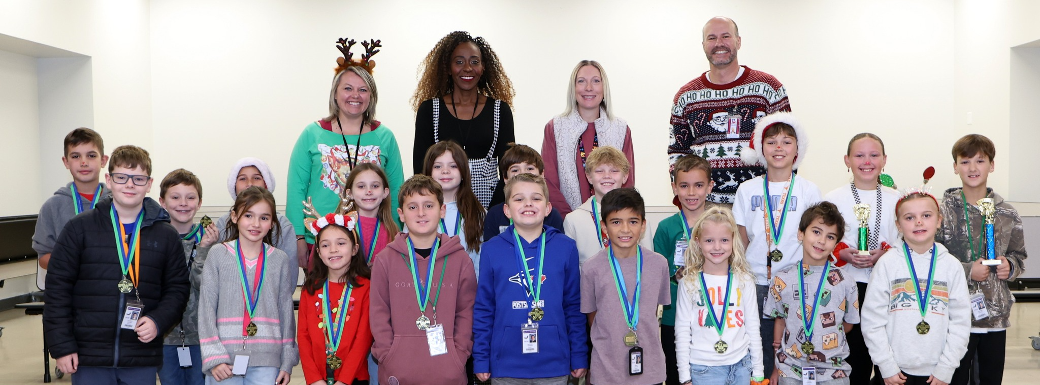 Spelling bee participants with judges and admin