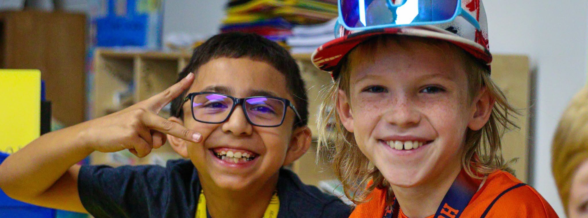 Two students smiling at the camera for a photo.