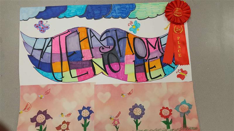 A colorful poster featuring a large, stylized mustache with the words "HALL HAS SOME" and "NO FEAR" in vibrant letters, adorned with flowers and a red ribbon award on the side.
