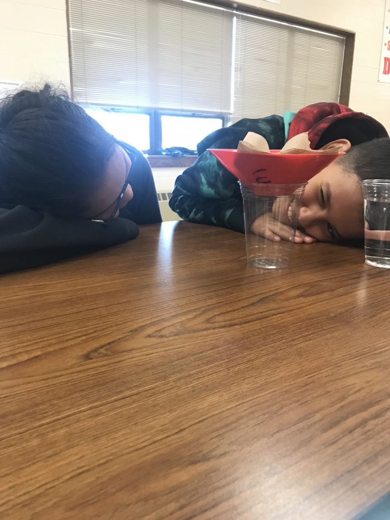 Two children with their head in their desk
