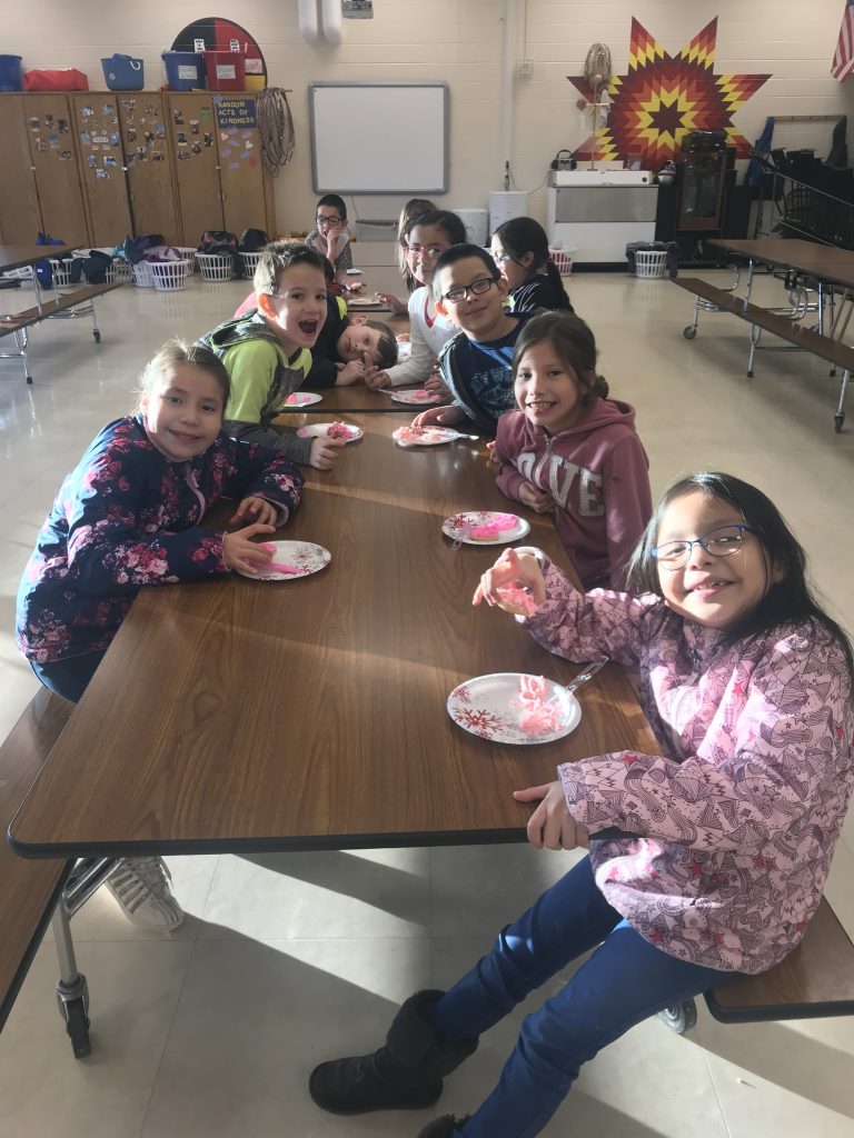 Children sitting at lunch table