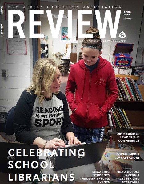 A magazine cover featuring a woman and a girl engaged in a discussion at a library, with the text 'Celebrating School Librarians' prominently displayed.
