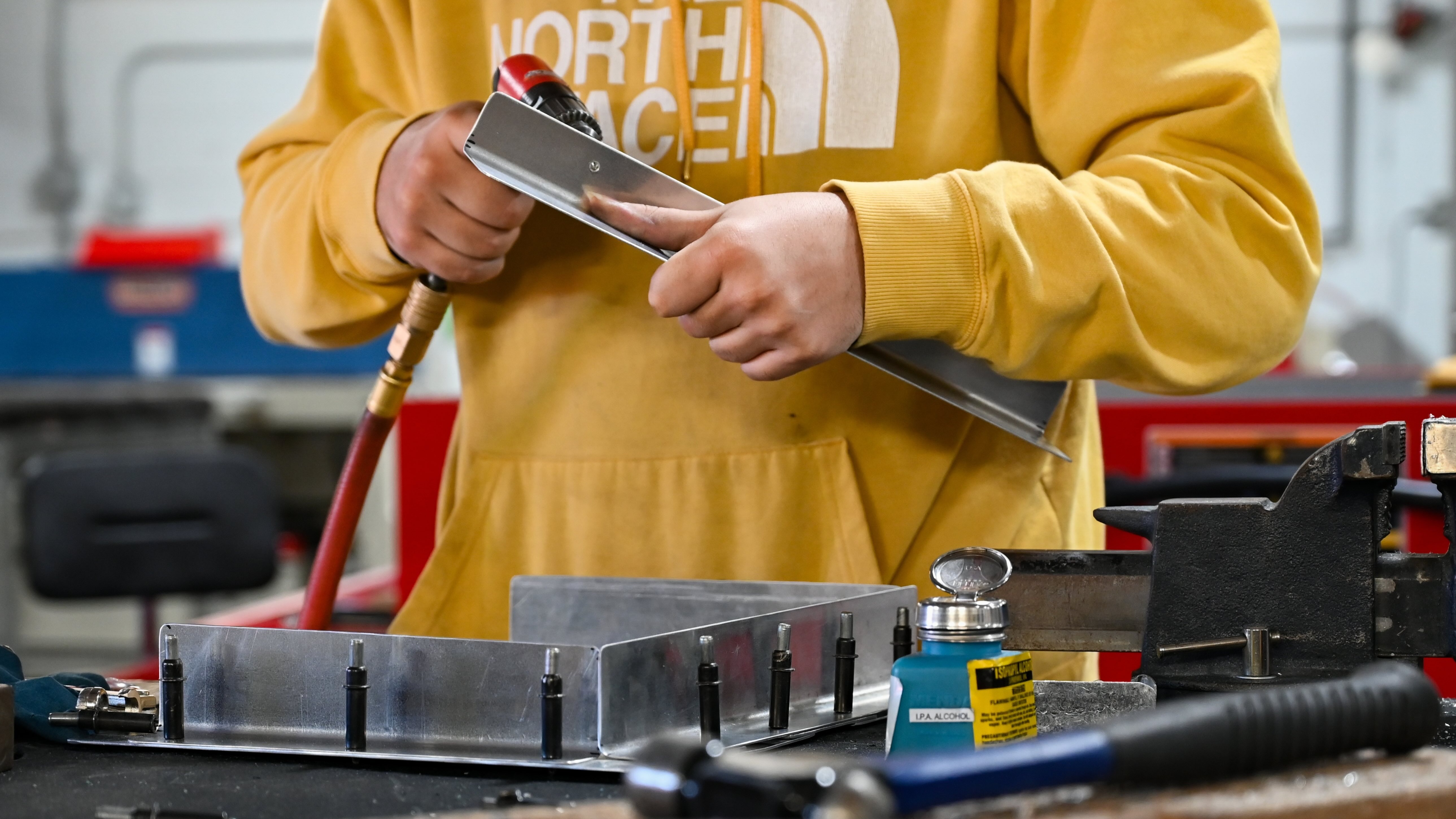 Person working with sheet metal