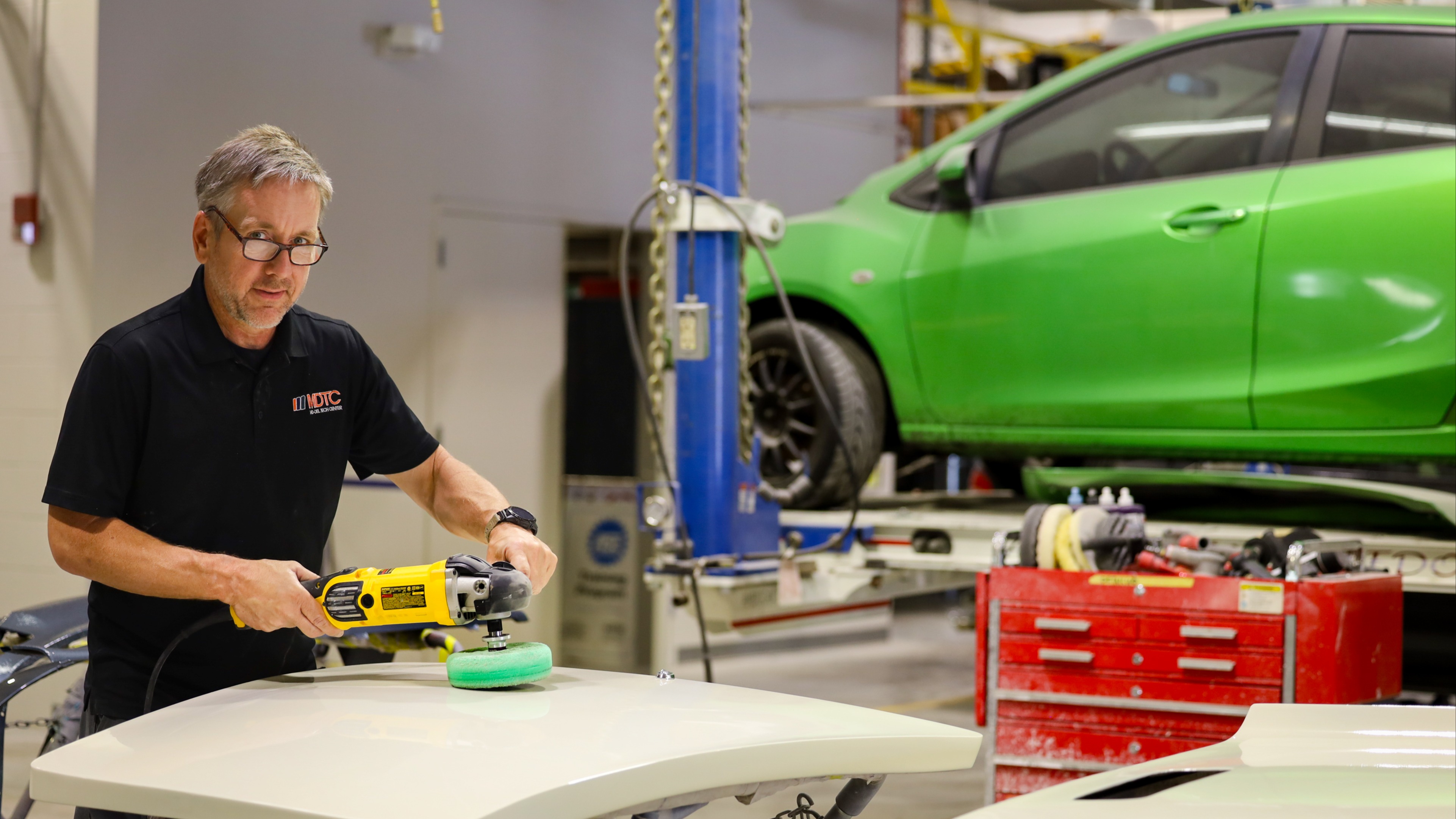 Man buffing a car